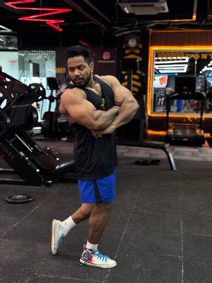 If you want peace, prepare for war. A side chest pose showing readiness.