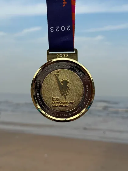 The 2023 TCS New York City Marathon finisher medal. A symbol of dedication and conquering one of the world's most famous races.