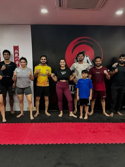 The Saturday BJJ class poses for a group photo after a great session. Our weekend classes are a popular way for members to learn new skills and connect with the community.