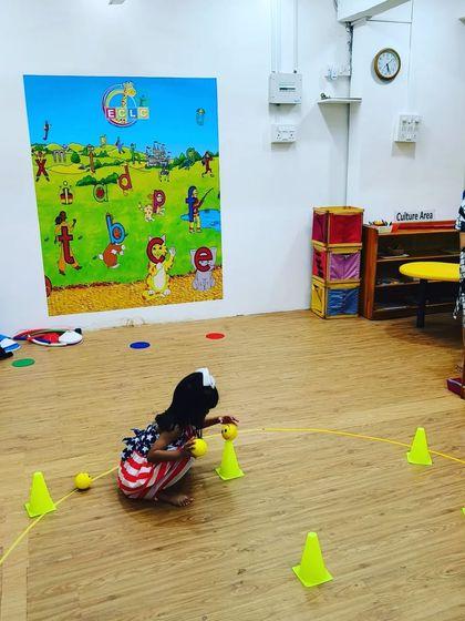 A moment of focus! This little champ is concentrating on picking up the ball during one of our games. These simple actions are building important fine motor skills and hand-eye coordination, all disguised as playtime.