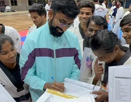 Reviewing documents and speaking with participants during a national seminar. It is important to provide clear guidance and mentorship to the next generation of referees.