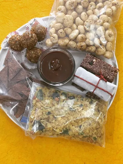 Another view of my on-the-go snack collection. These wholesome treats like my crunchy millet chivda and almond walnut laddus are designed to keep you fueled and satisfied throughout your day.