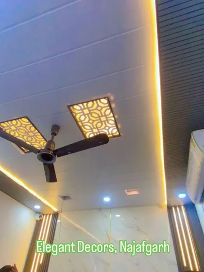 I create modern false ceilings that completely change a room's look. Here you can see a PVC false ceiling with custom geometric cutouts and integrated warm profile lighting, designed to be both stylish and durable. This is a waterproof and termite-proof solution for any home or office.