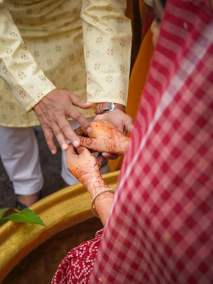 A close-up of a ritual during a Haldi ceremony. I capture these small, meaningful interactions that are a core part of the traditional wedding experience.