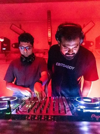 The red laser beams cut through the darkness as two DJs mix for the crowd. It's these moments of visual and auditory synergy that make our events stand out.