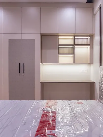 I designed this guest bedroom to feel like a warm welcome. The neutral palette, integrated study nook, and textured wardrobe doors create a space that is both beautiful and functional.