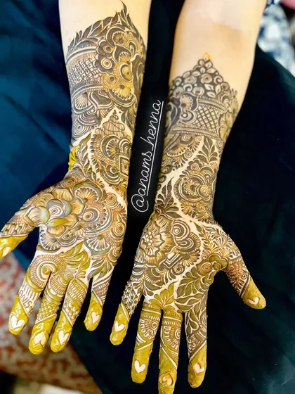 Another angle of the same beautiful bridal mehndi. The symmetry and attention to detail are key to creating a perfect bridal look.