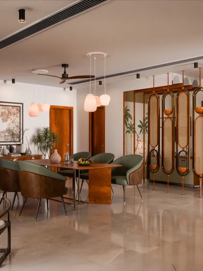 This dining space is all about creating a warm, inviting atmosphere. I combined rich wood finishes with soft green chairs and a beautiful cane partition to add texture and charm. The pendant lights and brass accents bring just the right touch of elegance for memorable dinners.