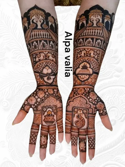 A full bridal arm design featuring classic Rajasthani elements. Notice the detailed palace architecture at the top, the royal elephant procession, and the delicate peacock and lotus motifs integrated into the palms.