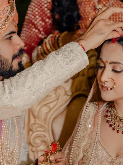 A close-up of a traditional wedding ritual. I can perform soft, instrumental, or devotional music that adds a layer of grace and sanctity to the wedding ceremony itself.