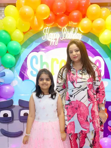 The birthday girl and her mom posing in front of the colorful Numberblocks party decor. We love celebrating with you!