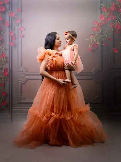 Capturing the timeless bond between a mother and her child. This portrait showcases one of my fine-art sessions, using soft lighting and elegant gowns to create a dreamy, painterly effect that you will cherish forever.