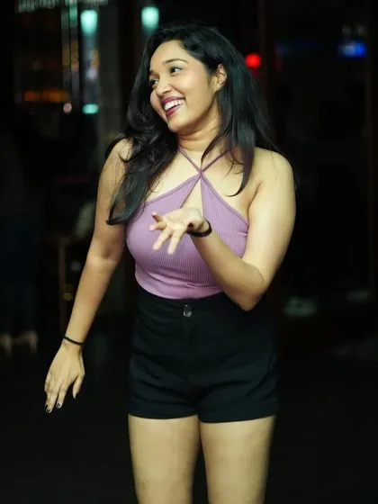 Lost in the rhythm. A perfect candid shot of someone feeling the music on a Saturday night at Badmaash.