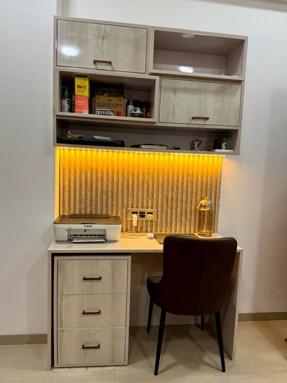 A detailed shot of the study unit, showing the overhead storage and lighting.