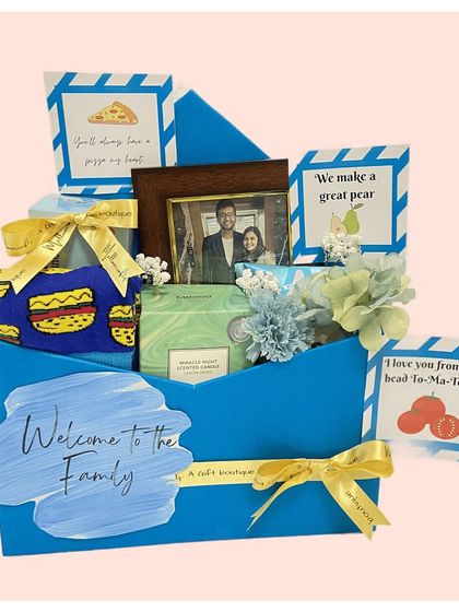 Our mini envelope hampers are a unique and creative way to gift. This blue envelope opens up to reveal a curated selection of goodies with quirky, pun-filled messages.