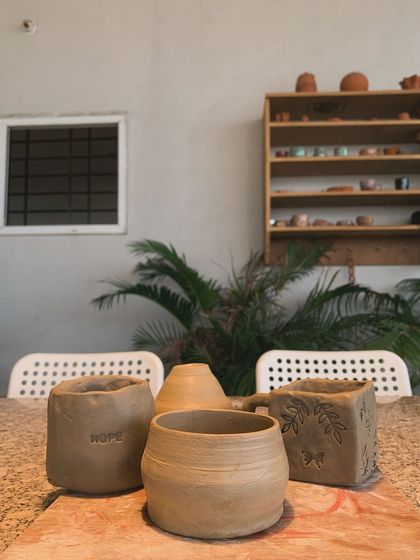 Another view of the raw pieces, with the "HOPE" pot in the foreground.