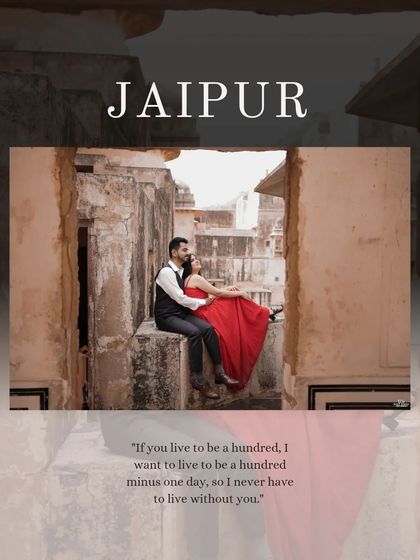 A beautifully framed shot of the couple sitting on a ledge at Amer Fort, with the word "Jaipur" elegantly overlaid, capturing the essence of a destination shoot.