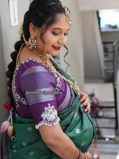 Celebrating life's precious milestones is an honor. I designed this custom blouse for our beautiful client Parinitha's baby shower, ensuring she felt comfortable and radiant on her special day.