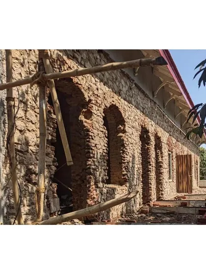 Exposing the original load-bearing stone masonry walls. Before applying new plaster, we carefully inspect and repair the underlying structure, using traditional techniques to maintain the building's authentic fabric and strength. This is a crucial part of our conservation process.