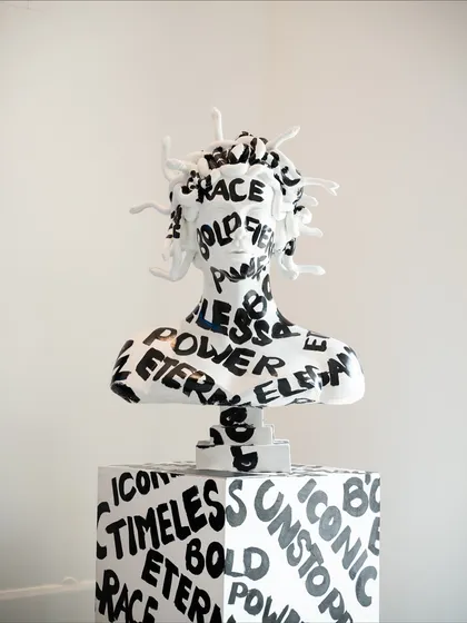 "Medusa: The Eternal Icon" is a striking acrylic installation that transforms a mythological figure into a symbol of empowerment. Her form is adorned with words like "Fierce," "Bold," and "Unstoppable."