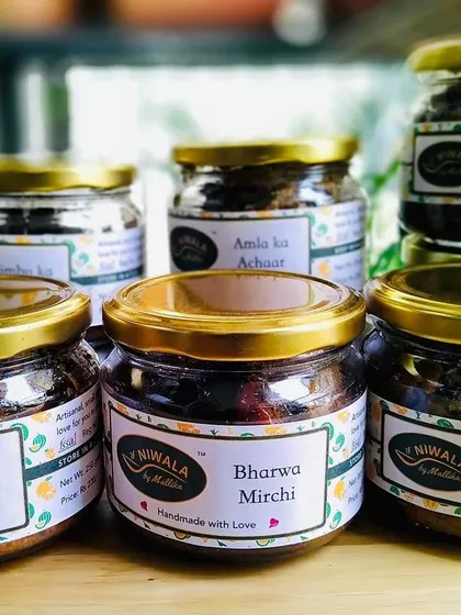 A beautiful lineup of my homemade pickles, featuring new labels. You can see my Mix Veg, Bharwa Mirchi, Hari Mirch ka Achaar, Amla ka Achaar, and Ghissu Aam Chana pickles, all made in small batches with traditional recipes.