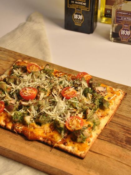 This is my chicken genovese flatbread, generously topped with pesto, chicken, and grated Grana Padano cheese. It is a sophisticated yet comforting appetizer that brings a taste of Italy to your gathering.