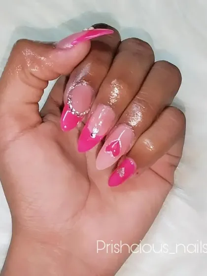Another angle of this pretty pink Valentine's manicure, showing the almond shape and the subtle sparkle of the rhinestones.