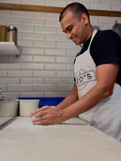 The rhythmic motion of kneading and shaping the dough. It's a process I never get tired of.