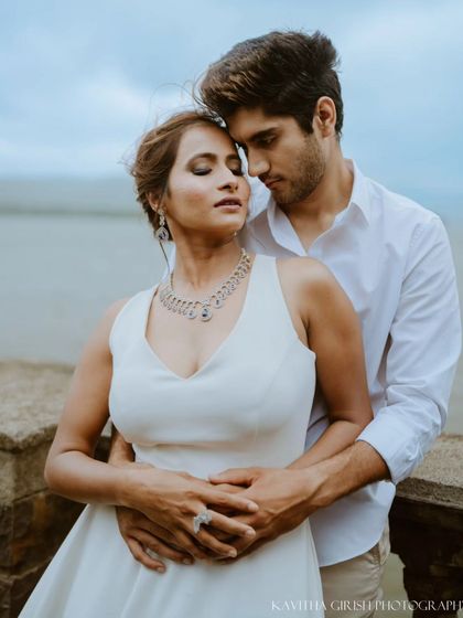 A serene and emotional close-up of a couple by the lake, lost in the moment. I guide my clients into poses that feel natural and bring out their connection.