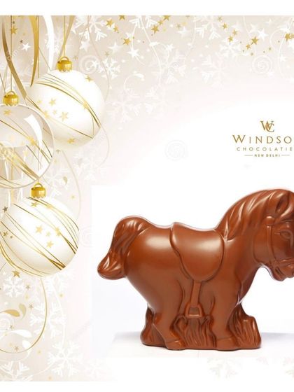 A simple but elegant solid milk chocolate horse sculpture, showcasing the smooth, glossy finish of the premium couverture I use.