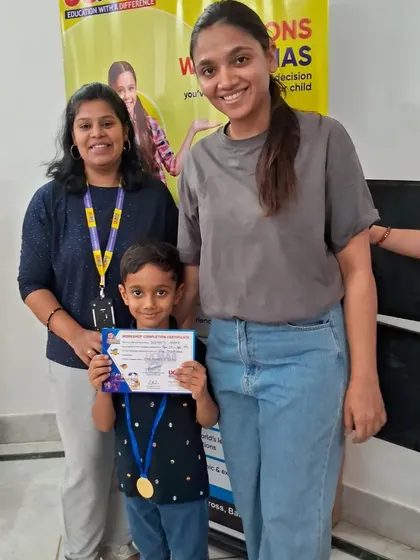 A smile of success. Congratulations to this student on his well-earned certificate.