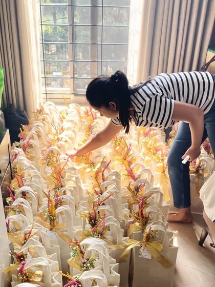 A final quality check before these 200 hampers go out for delivery. I personally inspect every single gift to ensure it meets my standards of quality and beauty.