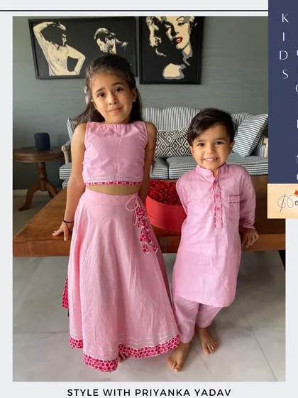 For this adorable brother and sister duo, I created a coordinated ethnic set in a lovely shade of pink. The girl's lehenga choli features delicate embroidery that complements her brother's simple yet smart cotton kurta pajama.