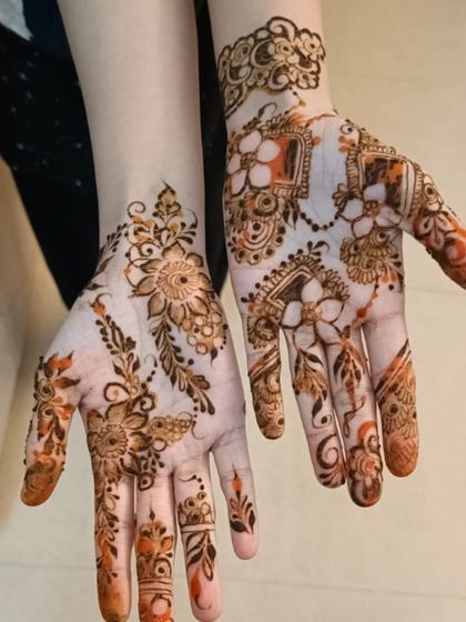 A mix of different floral styles on each hand, for a unique and personalized look.