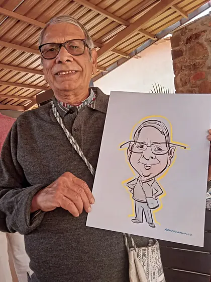 A gentleman with his full-body caricature, a great memento from the day.