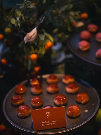 A detailed shot of our vanilla and crispy caramel choux pastries. The glossy caramel topping and perfect presentation showcase the high level of skill in our kitchen.