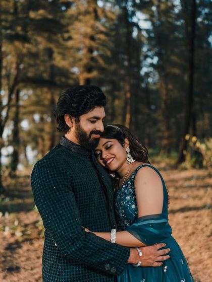 A sweet moment captured between the couple, showcasing their perfectly matched ethnic wear.