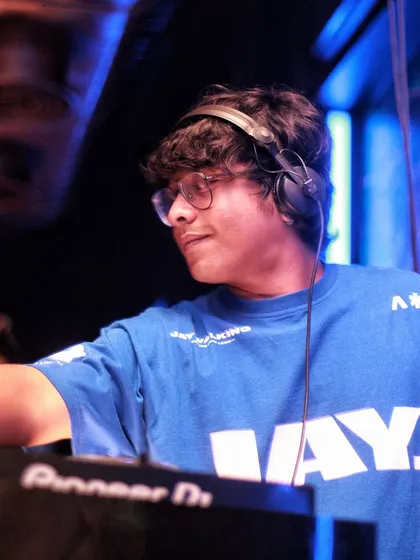 A cool shot of me behind the decks, in my element. This photo captures the focus and passion I have for my craft.