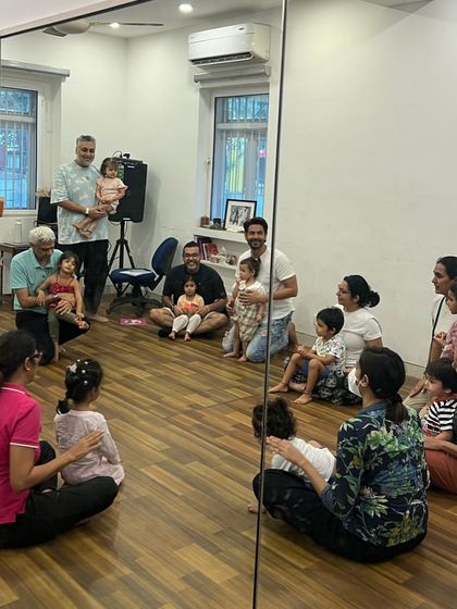 A beautiful moment showing different family members bonding with their children in class. We love creating a space where dads, moms, and grandparents can share in the musical journey.