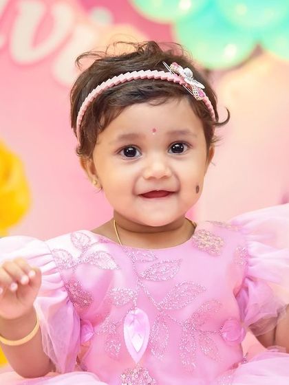 A thrilling 'Hot Wheels' themed birthday party, with checkered flags, car cutouts, and a custom racetrack backdrop, perfect for little speed enthusiasts.