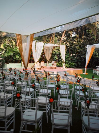 A collection of stunning wedding setups at The Farmhouse Collective. You can see the venue's versatility, from elegant morning ceremonies with floral mandaps to glamorous evening receptions with fairy lights and chic decor. This space is a blank canvas for your dream outdoor wedding in Bengaluru.