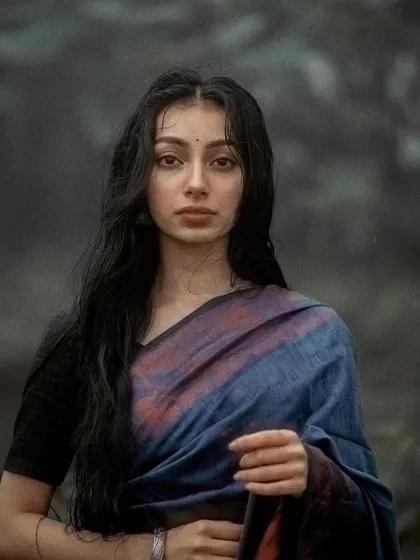 A direct, straight-on portrait from the monsoon series. Even in the stillness, I try to convey an inner emotional landscape.
