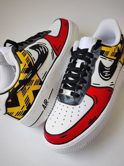 This shot shows both the retro "Bruised Banana" pattern and the modern away jersey pattern on one shoe. It's a tribute to the club's history and present.