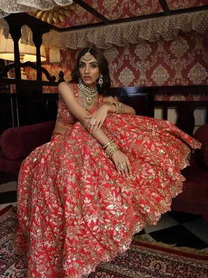 A confident and regal pose, with the bride looking directly at the camera. The styling here is all about power, elegance, and timeless beauty.
