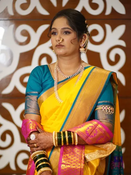 A portrait of the bride during her Punyawachan ceremony. The makeup is subtle, allowing her natural beauty and the traditional attire to take center stage.