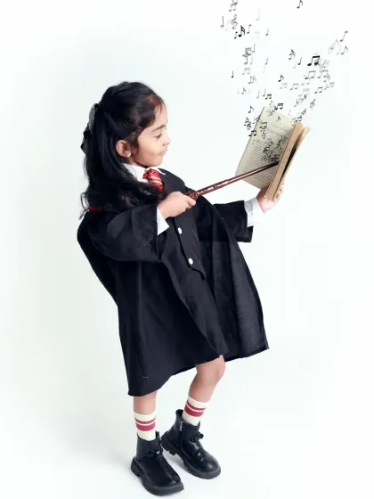 Casting a musical spell. This Harry Potter-themed studio shot combines magic and music for a truly unique portrait.