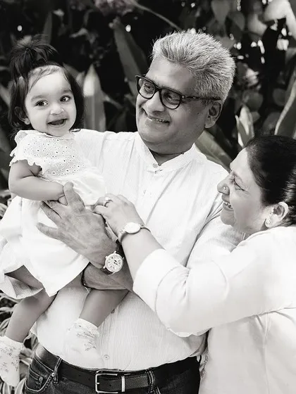 The same beautiful moment with grandparents, captured in timeless black and white to emphasize the emotion and connection across generations.