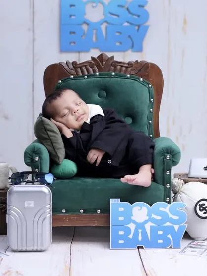 Introducing the new head of the household with our creative 'Boss Baby' themed newborn shoot. We use fun, detailed props to create a humorous and unique portrait while your little one sleeps soundly.
