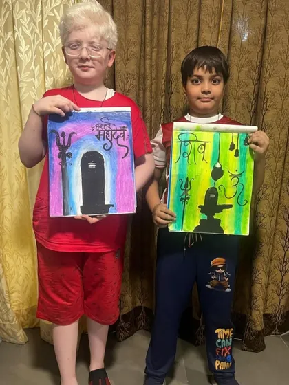 Here are two of my students showing their finished artwork inspired by Lord Shiva. Each piece uses a different color scheme and composition to express their devotion through art.