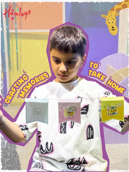 Crafting memories to take home! A young boy proudly displays the DIY bunting he made after our interactive storytelling session. It's a tangible reminder of a day filled with imagination.